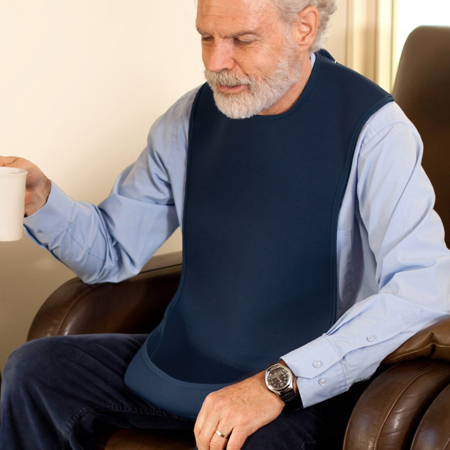 Care-Designs- Tabard adult bib - MEDIUM-NAVY-on-man-1-1500x1500