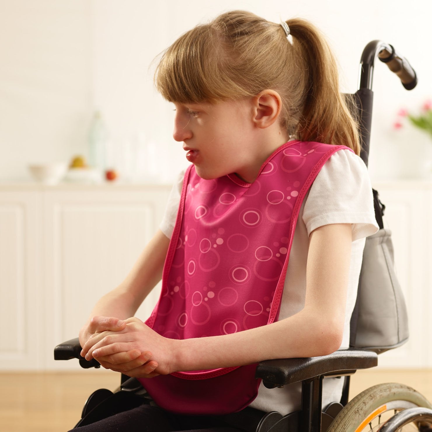 Care Designs Junior bib Pink Bubbles 1810 72dpi