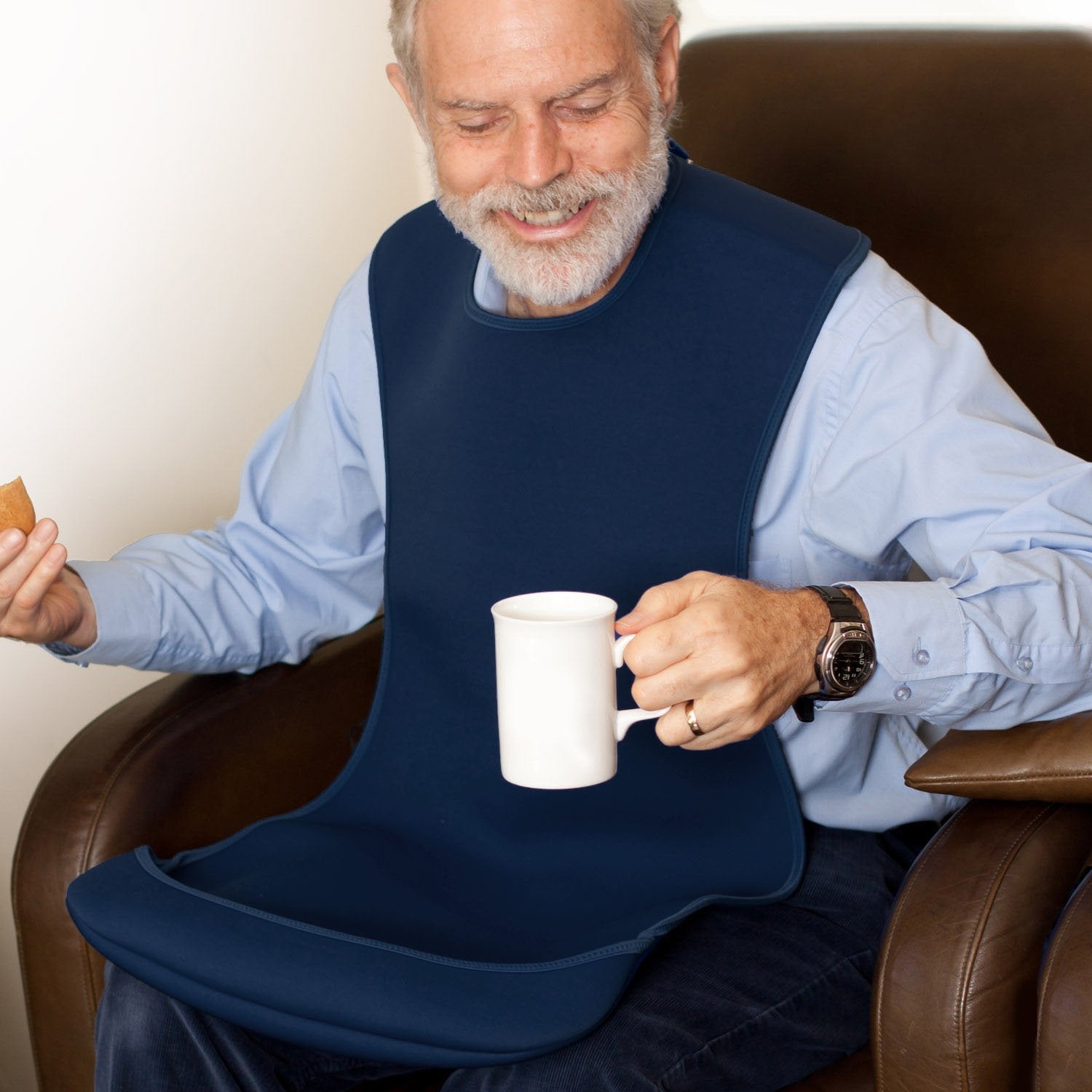 Care-Designs-Tabard-LARGE-NAVY-on-man-holding-mug-1500x1500