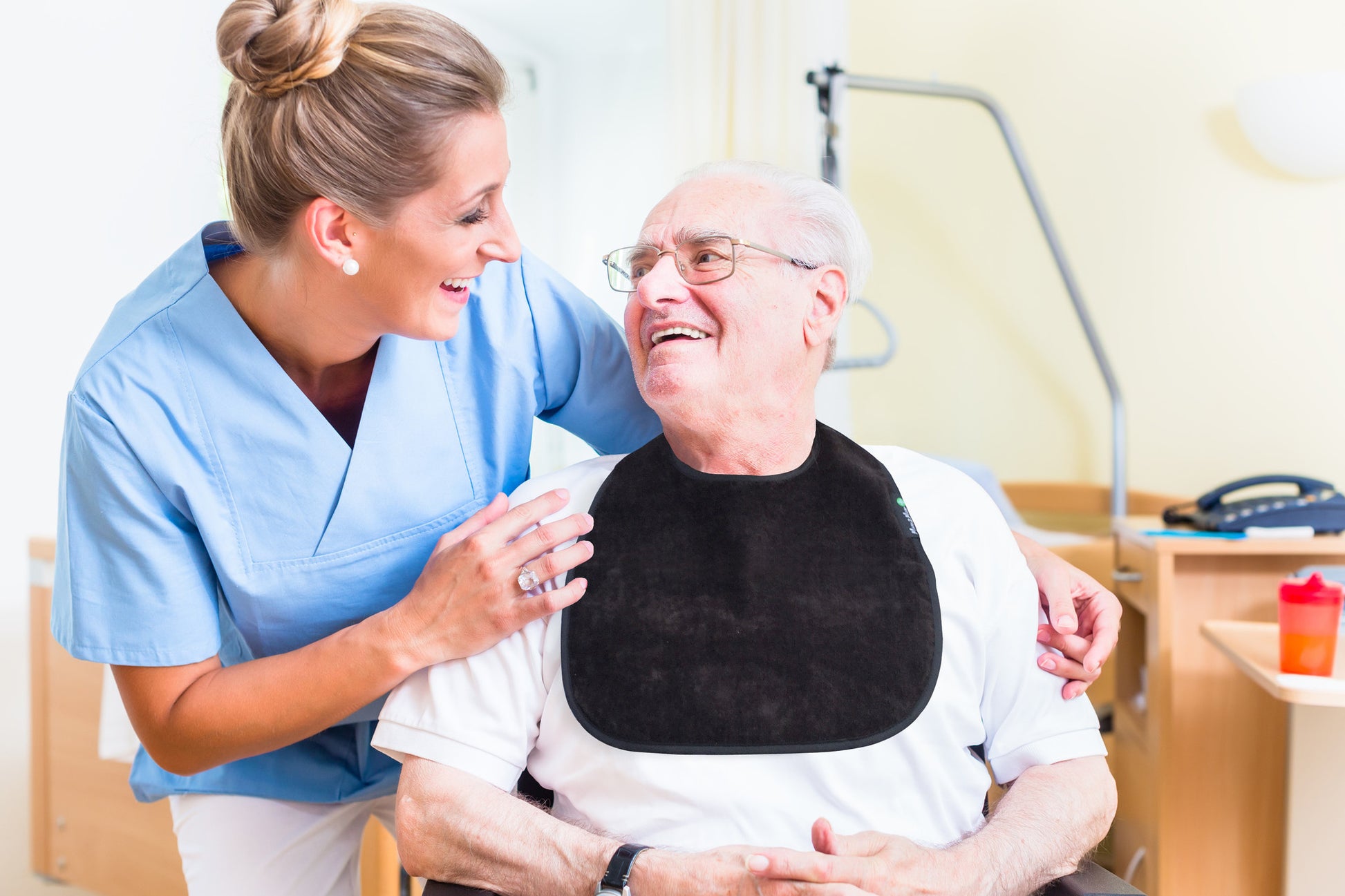 Elderly man black bib
